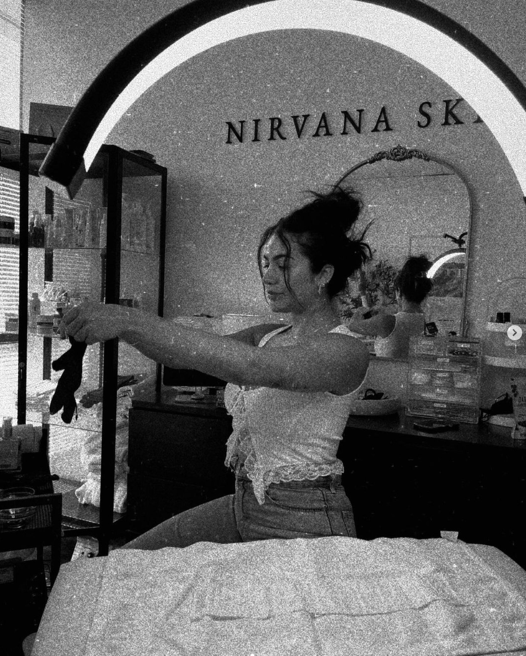 Preparing a treatment bed in the Nirvana Skin Co. studio in Rancho Cucamonga