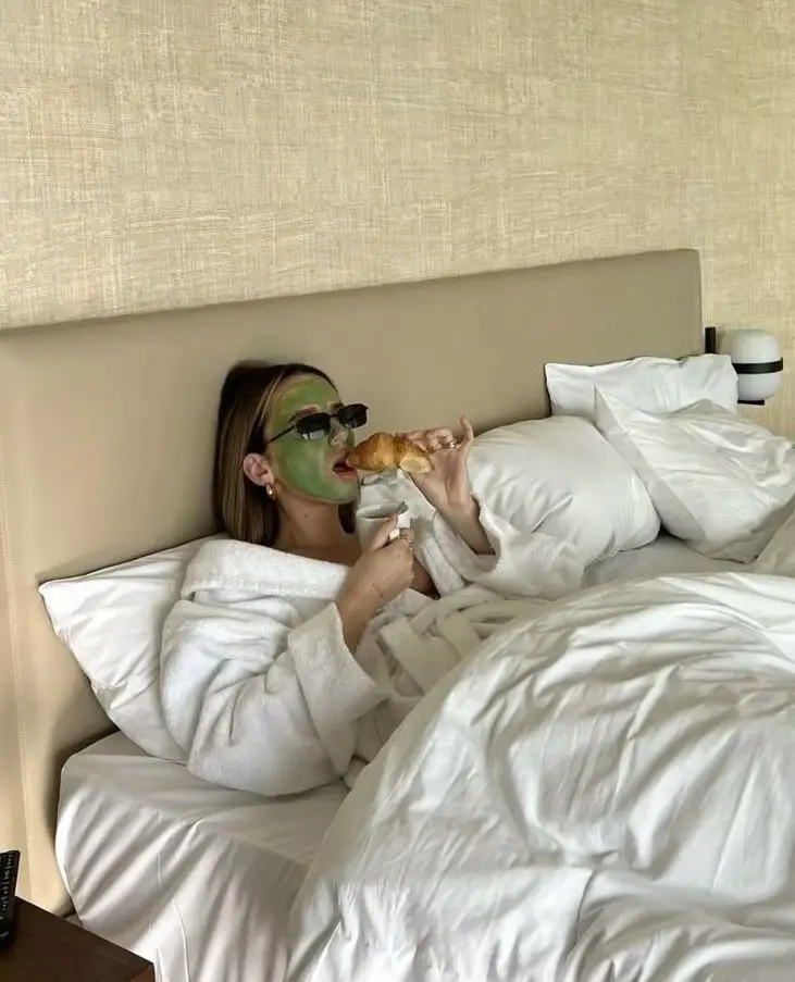 Unwinding in a robe with a face mask